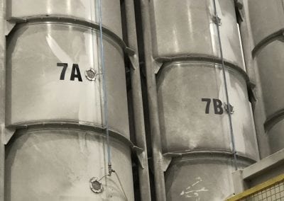 A large metal tank with numbers on it.