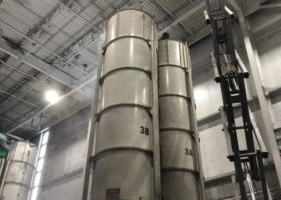 A large metal tank in a warehouse.