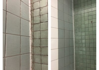 A bathroom with two different tiled walls.