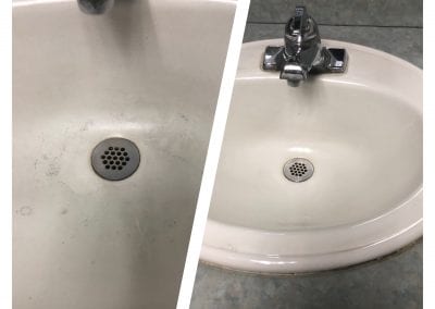 A sink with a drain and a faucet in it