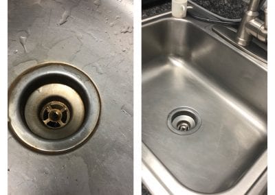 A sink with the drain out and a sink that has been cleaned.